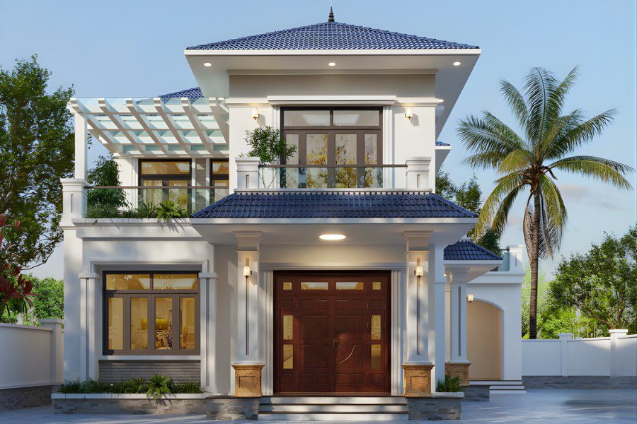 Mẫu nhà 2 tầng mái Nhật hiện đại màu trắng với ban công, giàn pergola và cổng vào lớn bằng gỗ.