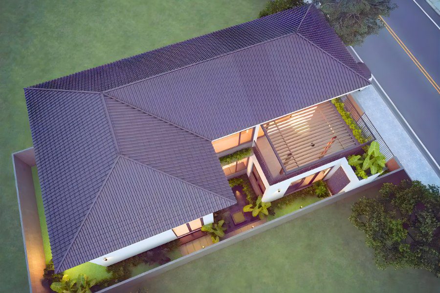 mẫu nhà cấp 4 mái Nhật chữ L với sân sau có giàn che pergola và cây xanh.