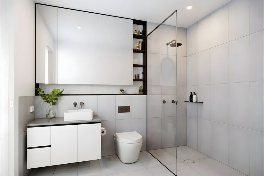 Mẫu nhà vệ sinh đẹp cho căn hộ chung cư với gương lớn và tủ chậu lavabo đa năng.